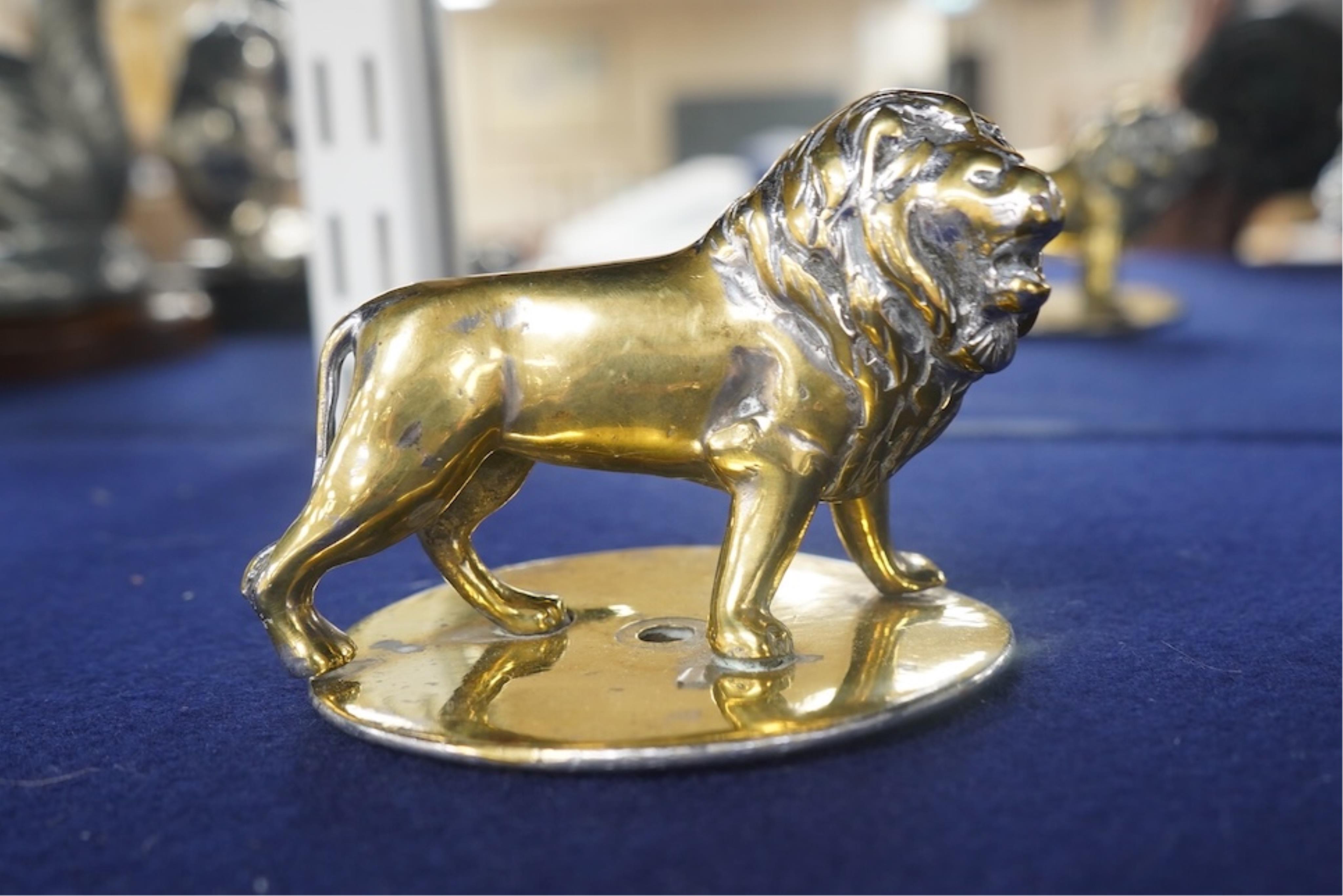 Four lion and big cat related brass and chrome car mascots/figures, consisting of two lions, a tiger and another, possibly a panther. Condition - fair, some losses to chrome.